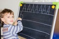 Boy writing letters learning procces son smart child Royalty Free Stock Photo