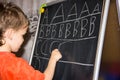 Boy writing letters learning procces son smart child Royalty Free Stock Photo