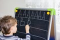 Boy writing letters learning procces son smart child Royalty Free Stock Photo