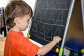 Boy writing letters learning procces son smart child Royalty Free Stock Photo