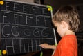 Boy writing letters learning procces son smart child Royalty Free Stock Photo