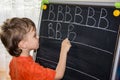 Boy writing letters learning procces son smart child Royalty Free Stock Photo