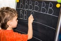 Boy writing letters learning process Royalty Free Stock Photo