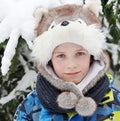 Boy 8 years of age in the header as a dog on snow background Royalty Free Stock Photo