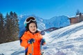 Boy 3 years old child with ski over mountains on background Royalty Free Stock Photo