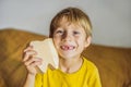 A boy, 6 years old, holds a box for milk teeth. Change of teeth Royalty Free Stock Photo