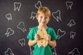 A boy, 6 years old, holds a box for milk teeth. Change of teeth Royalty Free Stock Photo