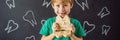 A boy, 6 years old, holds a box for milk teeth. Change of teeth BANNER, LONG FORMAT Royalty Free Stock Photo