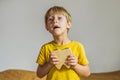 A boy, 6 years old, holds a box for milk teeth. Change of teeth Royalty Free Stock Photo