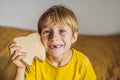 A boy, 6 years old, holds a box for milk teeth. Change of teeth Royalty Free Stock Photo