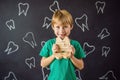 A boy, 6 years old, holds a box for milk teeth. Change of teeth Royalty Free Stock Photo