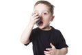 Boy 4 years old inhales himself on a white background