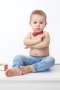 boy sitting on the floor in jeans and bow tie, little boss Royalty Free Stock Photo