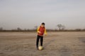 A boy of 10 years old plays soccer on an empty beach Royalty Free Stock Photo