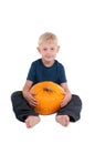 Boy with a yellow pumpkin Royalty Free Stock Photo