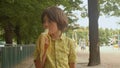 Boy in a yellow shirt is eating a banana stimulate the production of endorphins.