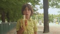 Boy in a yellow shirt is eating a banana stimulate the production of endorphins.