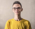 Boy with yellow T-shirt and smiling look