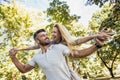 Boyfriend carrying his girlfriend on piggyback Royalty Free Stock Photo