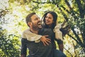 Boyfriend carrying his girlfriend on piggyback. Portrait. Royalty Free Stock Photo