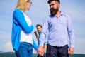 Boyfriend full jealous looks aggressive cheaters couple. Man found or detected girlfriend cheating him walking with