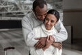 Boyfriend and girlfriend are embracing at airport Royalty Free Stock Photo