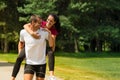 Boyfriend giving piggyback ride to girlfriend