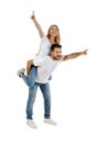 Boyfriend giving piggyback to girlfriend on white background Royalty Free Stock Photo