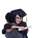 Boyfriend hug girlfriend on graduation - isolated