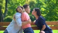 Boyfriend hugging girlfriend secretly kissing other woman, hidden relations