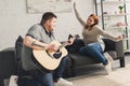 boyfriend playing guitar for happy girlfriend Royalty Free Stock Photo