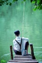 Boyish looking girl fishing outdoors