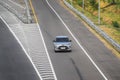 Silver Toyota Raize driving fast on trans jawa highway Royalty Free Stock Photo