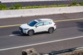 white Toyota Corolla Cross driving fast on trans jawa highway toll road blurry in motion Royalty Free Stock Photo