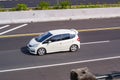 White Honda Jazz or known as Fit GE8 speeding on trans Java Highway Royalty Free Stock Photo