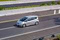 Silver Honda Jazz or known as Fit GE8 speeding on trans Java Highway Royalty Free Stock Photo