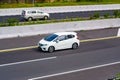 White Honda Jazz or known as Fit GK5 speeding on trans Java Highway Royalty Free Stock Photo