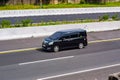 Black Toyota voxy driving fast on trans jawa highway