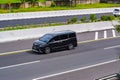 Black Toyota voxy driving fast on trans jawa highway