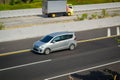 Silver Suzuki Ertiga driving fast on trans jawa highway Royalty Free Stock Photo