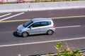 Silver Honda jazz or Honda fit i-dsi driving fast on trans jawa highway blurry in motion Royalty Free Stock Photo