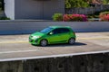 Green Mazda2 or Mazda demio on trans jawa highway