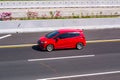 Red Honda Jazz or known as Fit Gk5 speeding on trans Java Highway Royalty Free Stock Photo