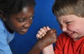 Boys arm-wrestling Royalty Free Stock Photo