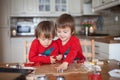 Boys, baking ginger cookies for Christmas