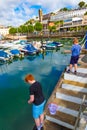 Boys catching crabs Torquay Harbour United Kingdom