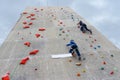 Boys climbing with rope at outdoor festival White Nights