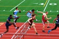 Boys competing in hurdles at a Track Competition