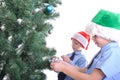 Boys decorating a Christmas tree Royalty Free Stock Photo
