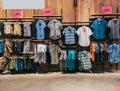 Boys department in clothing store. Shop of men`s clothing. Showcase rack with shirts. Shelves with clothes. The interior Royalty Free Stock Photo